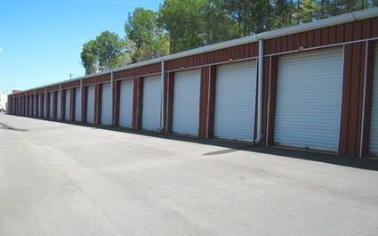 A row of self storage units outside.