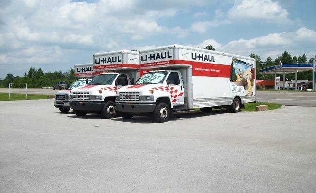 Three U-Hal trucks parked side-by-side.