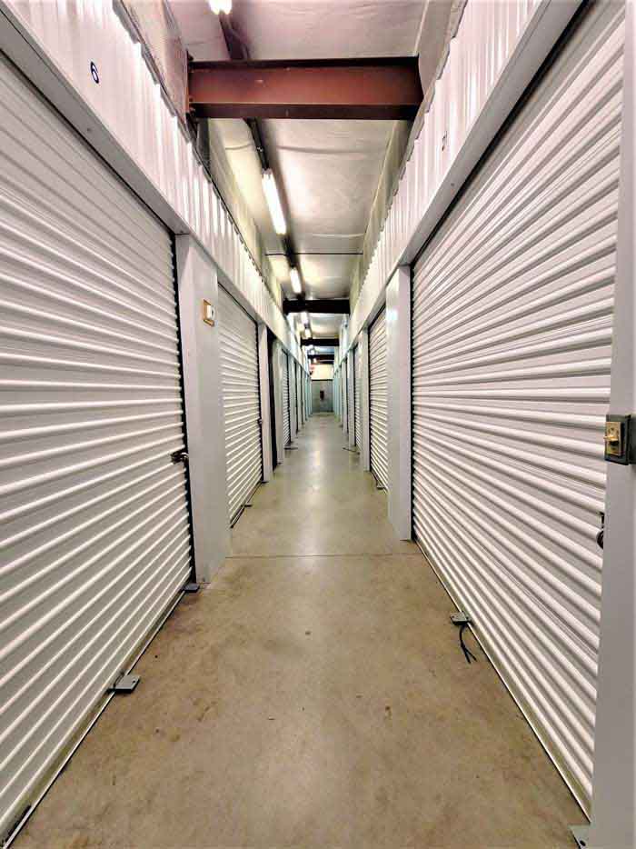 A hallway of interior, climate controlled storage units.