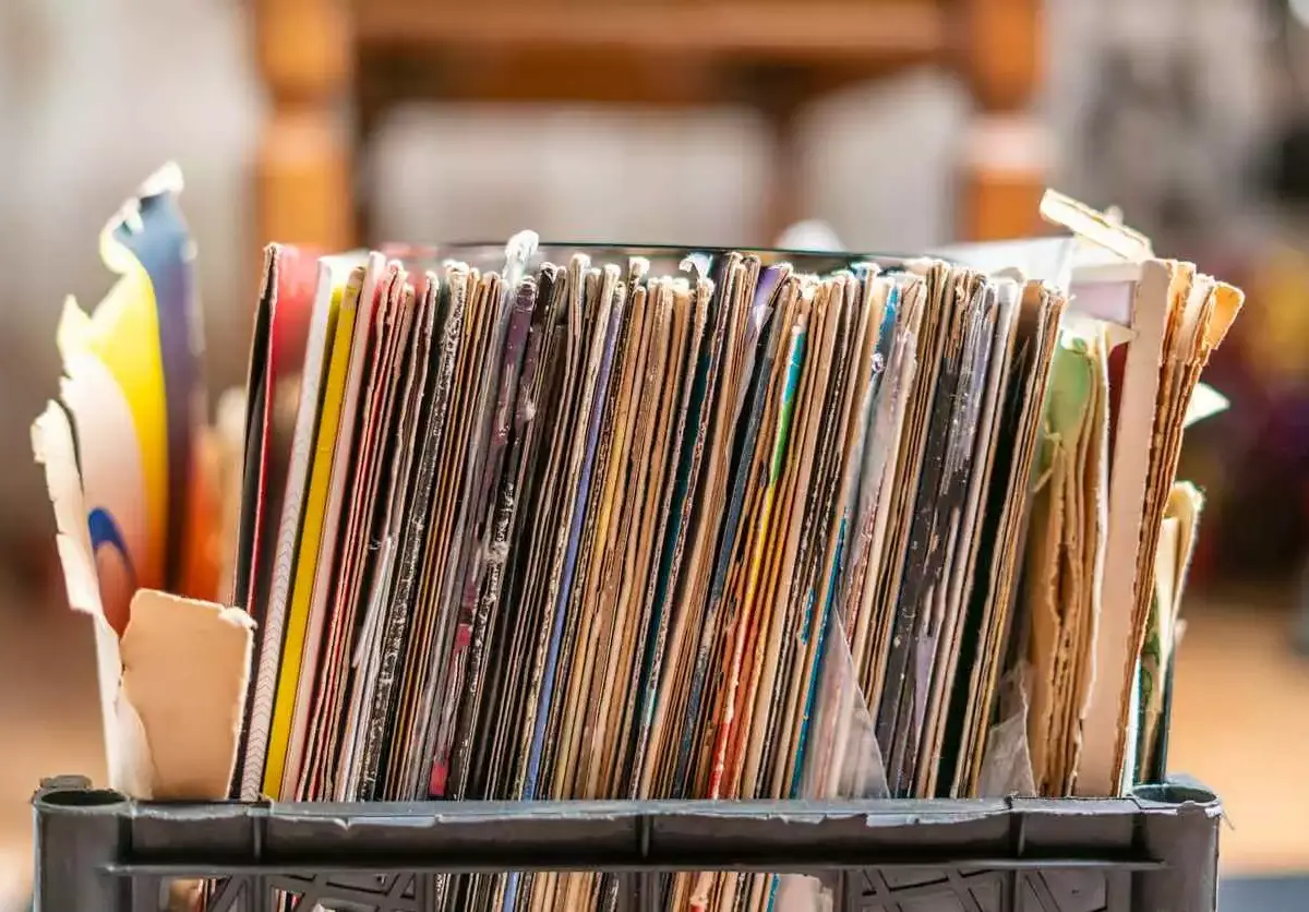 a stack of documents sits in a plastic crate