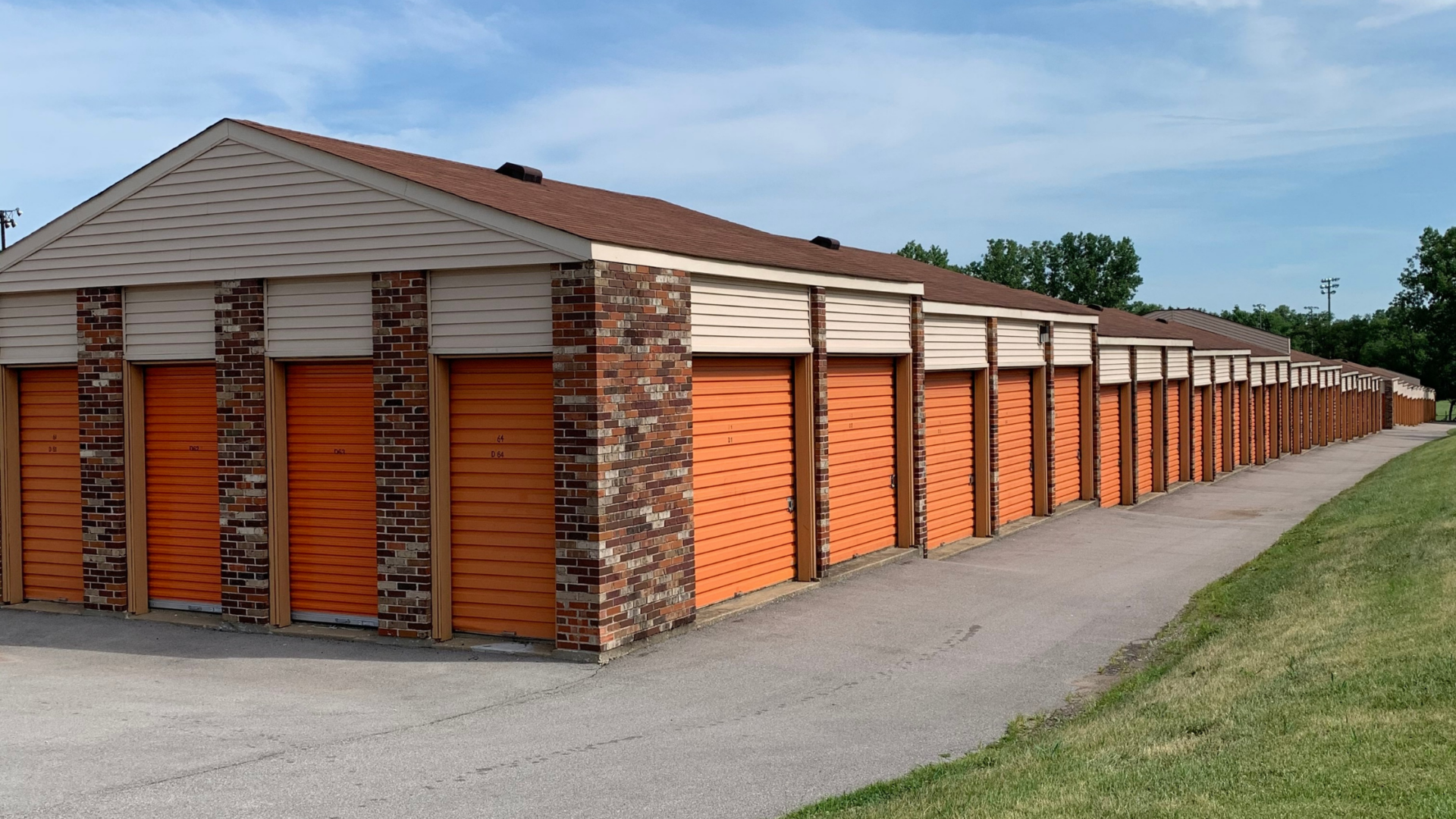 Outdoor storage units with garage doors.
