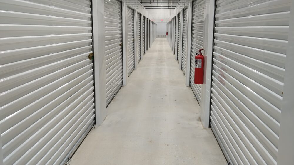 A hallway of interior, climate controlled storage units.
