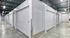 Interior storage units with white roll-up doors.