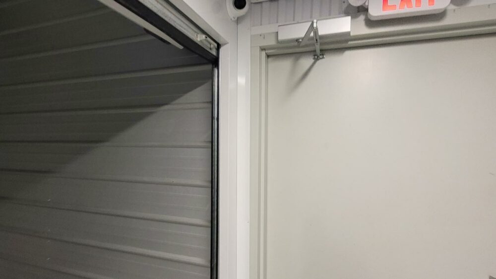 Silo Self Storage exit sign in an interior storage unit hallway.