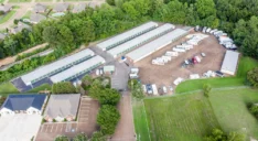 Arial view of a storage facility with drive up units and RV, Vehicle Parking