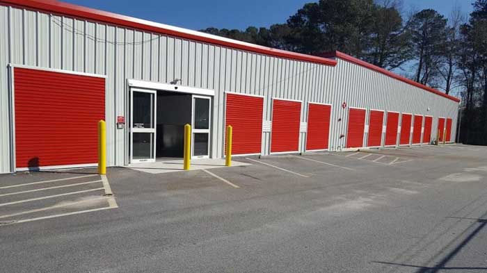 Drive-up access storage units and facility access door at Ellenwood's Best Storage.