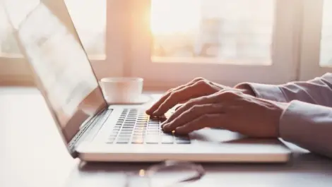 Person typing on a laptop