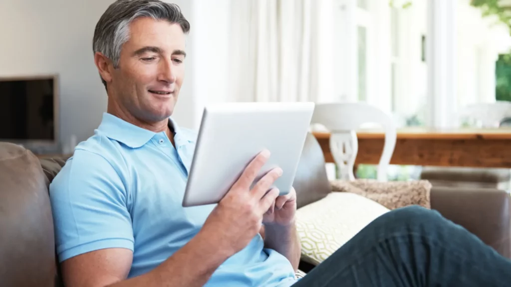 Stock photo of a man on a couch.