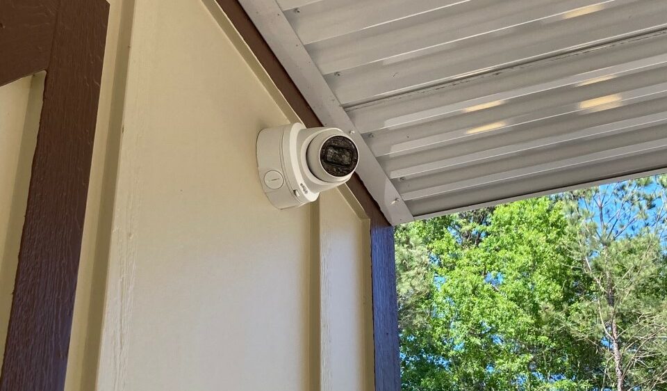 Security camera on the exterior of wall of the storage facility.