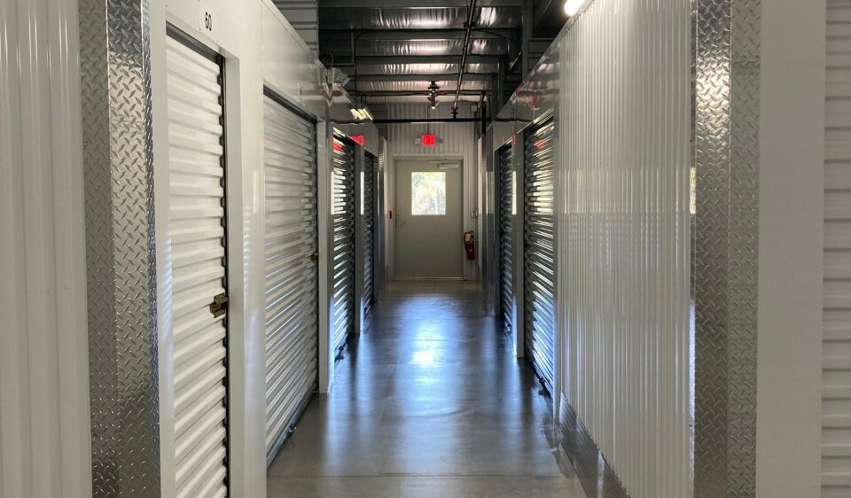 A hallway of indoor, climate controlled storage units.