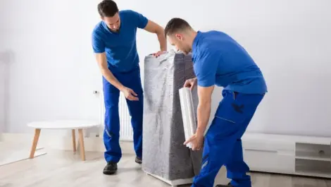Men preparing furniture for a move.