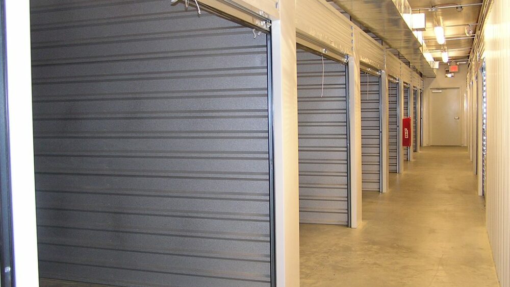 Medium, indoor storage units with their doors rolled-up.