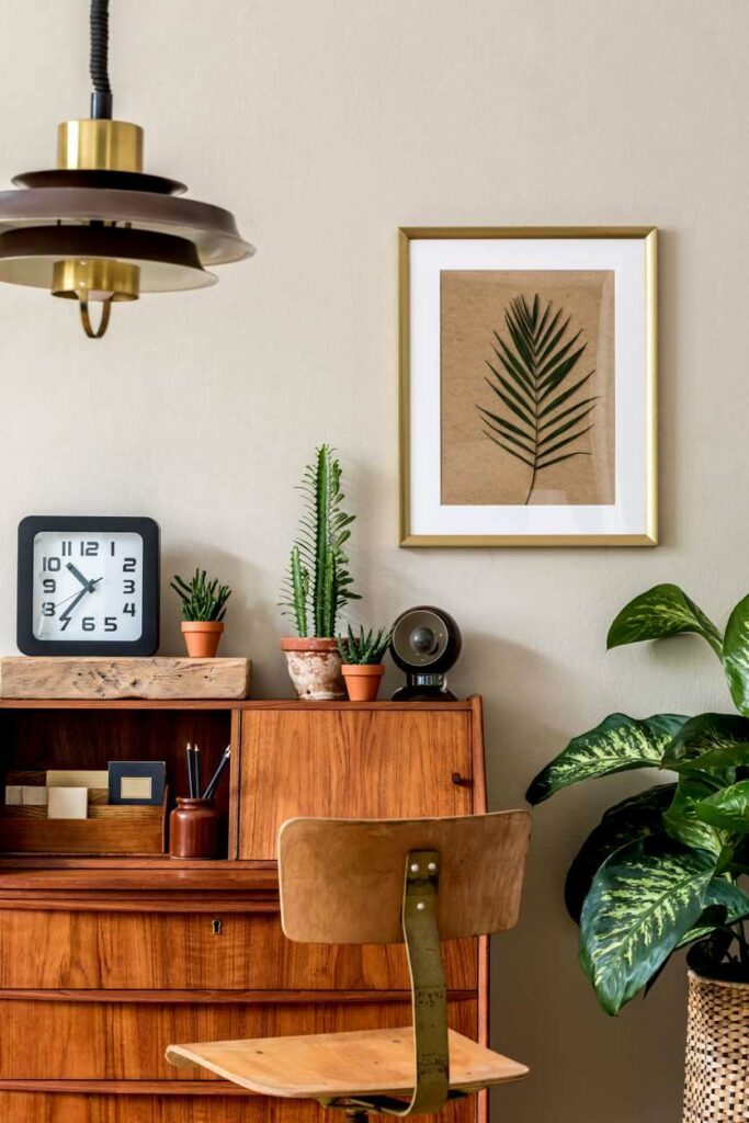 A vintage cabinet serves as a desk and shelf in a study area of a home