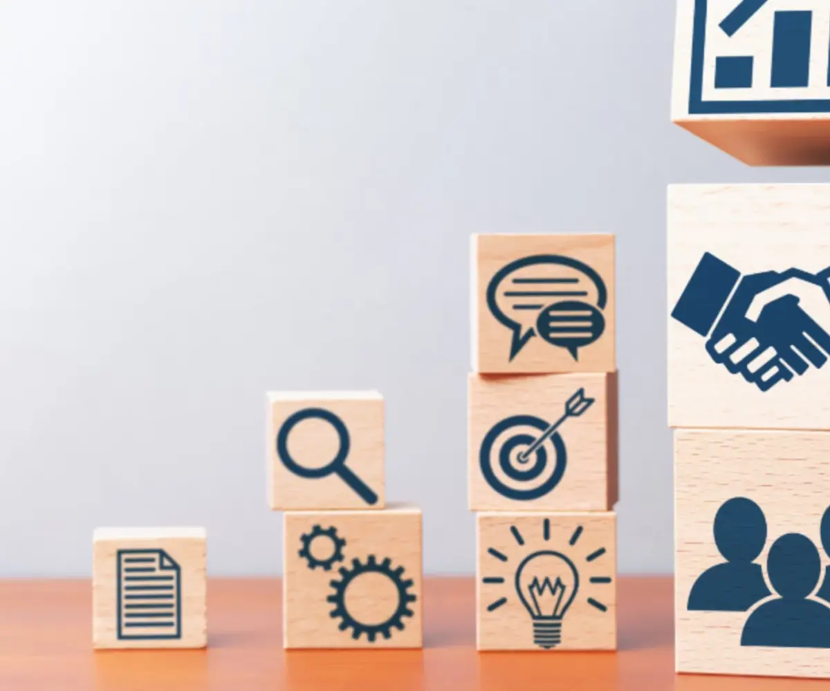 Building blocks with icons on them.