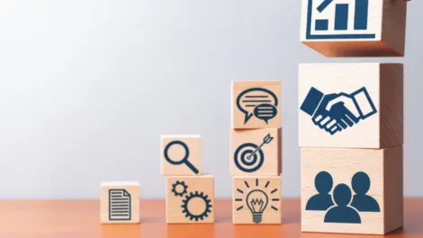 Building blocks with icons on them.