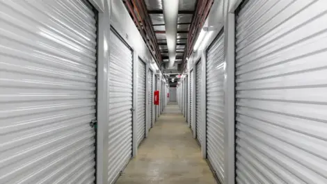Looking down a hallway inside a storage facility