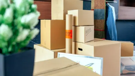 Stacks of cardboards sit neatly outside a storage unit
