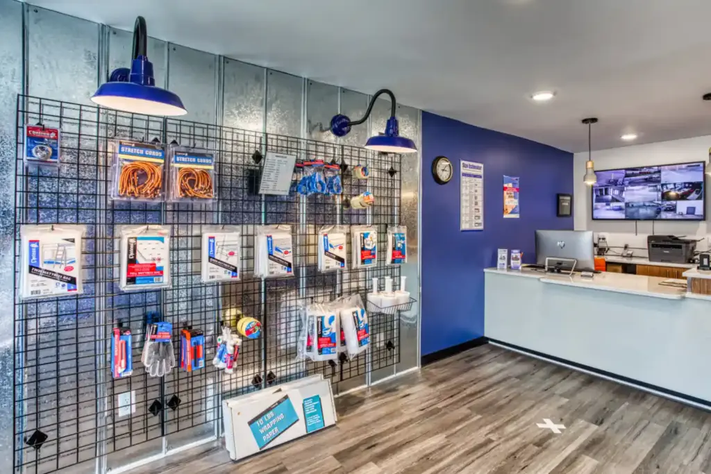 Interior of storage facility office with customer service desk and moving and packing supplies.