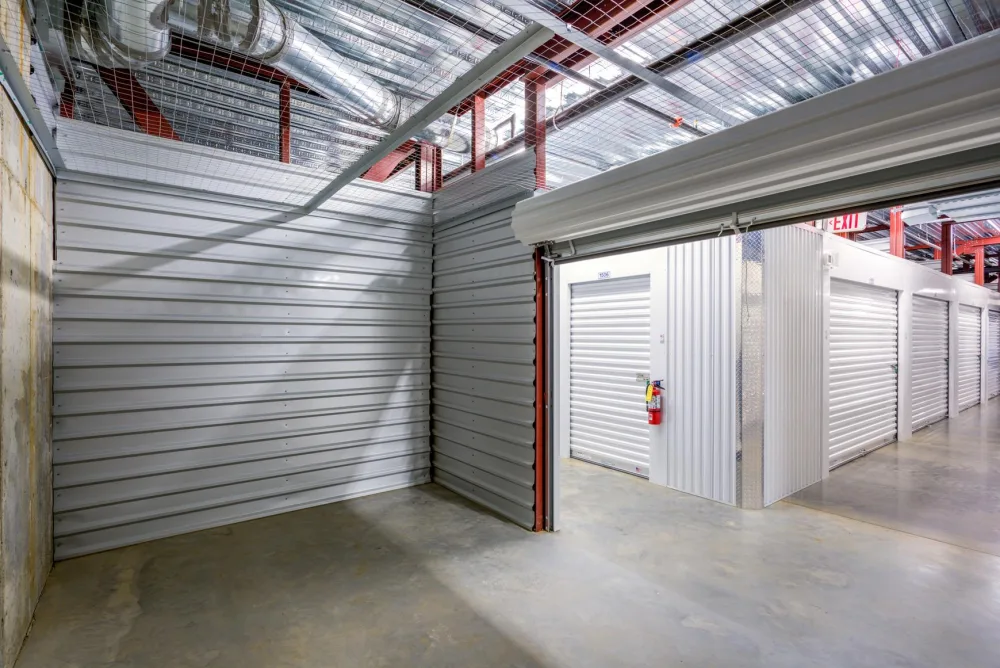 The interior of a clean, medium storage unit with the door up.