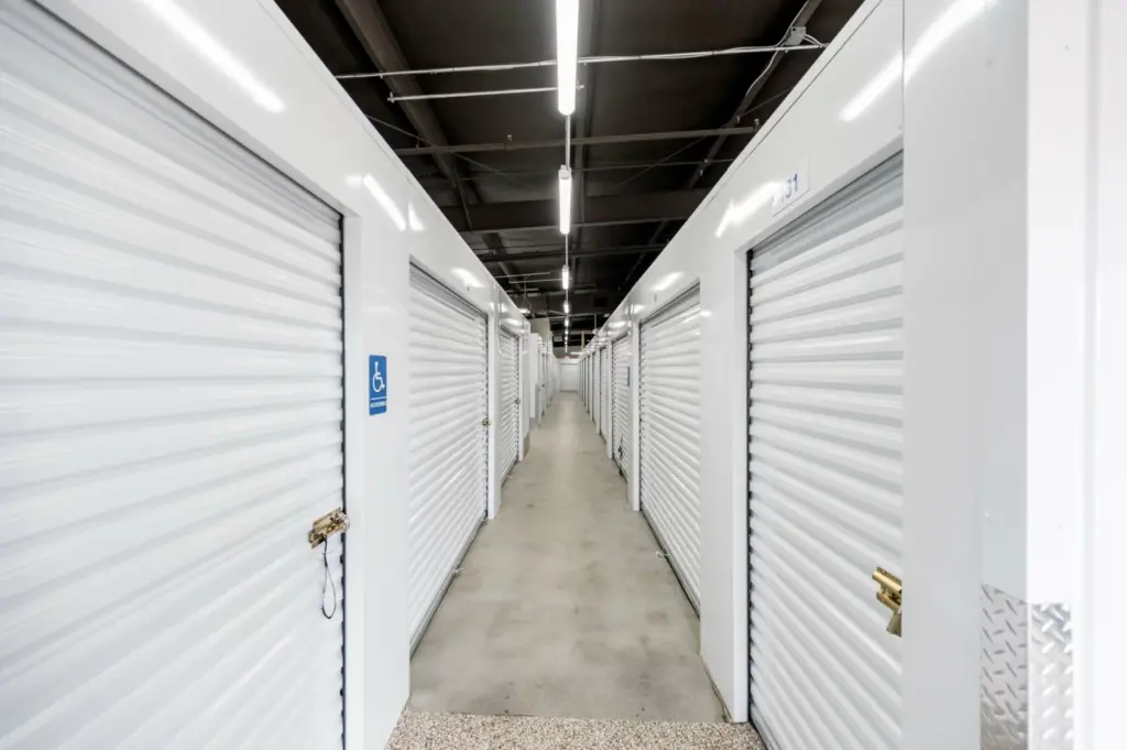 Hallway perspective of indoor storage facility units.