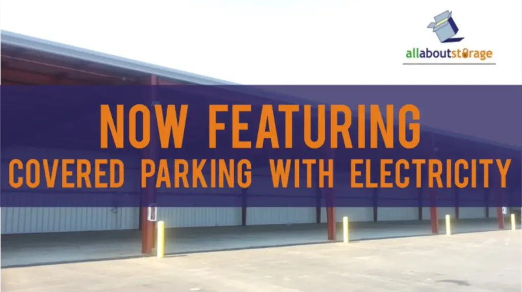 Covered parking with electricity advertisement for All About Storage.