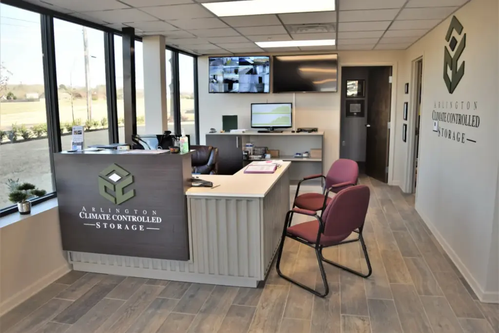 Inside office with a cubicle and two chairs.