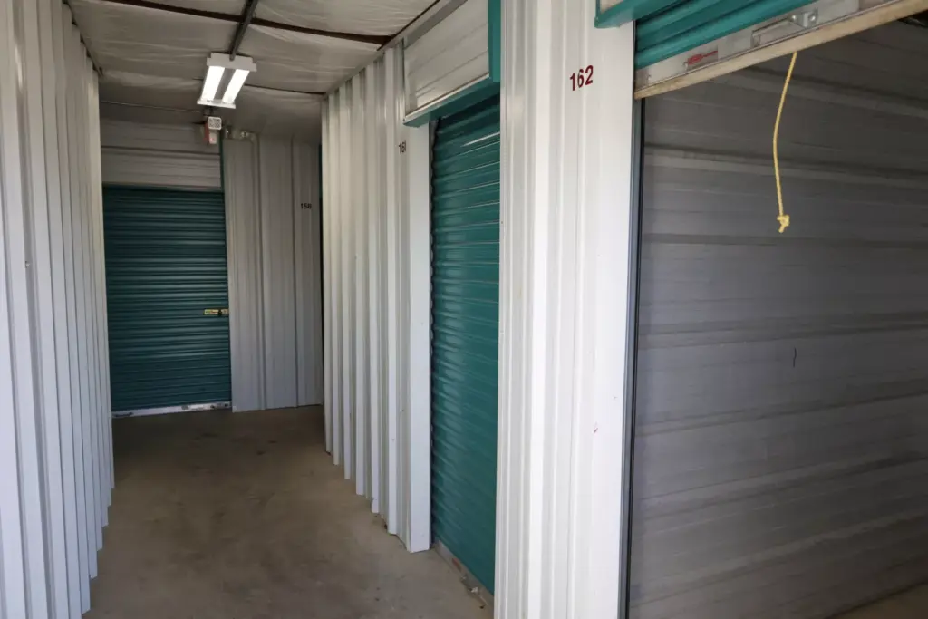 Indoor storage unit with an open door.
