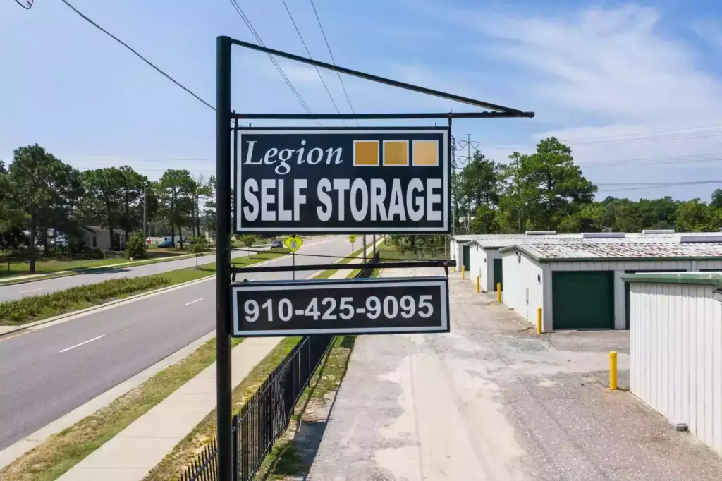 Legion Self Storage sign with phone number 910-425-9095