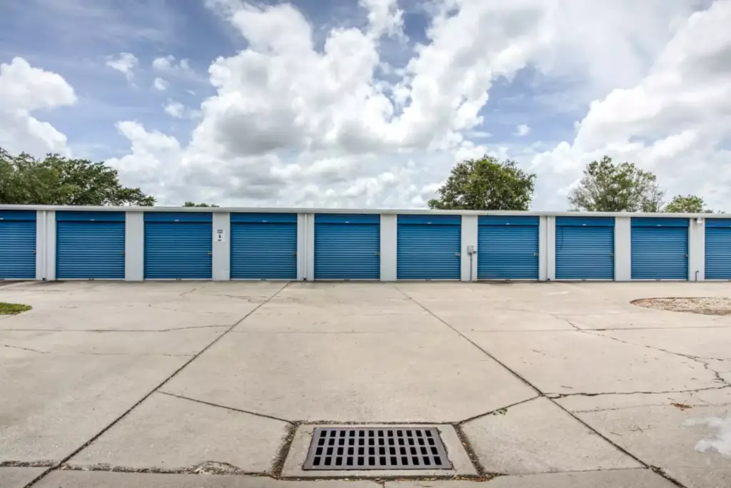 Row of outdoor drive up storage units.