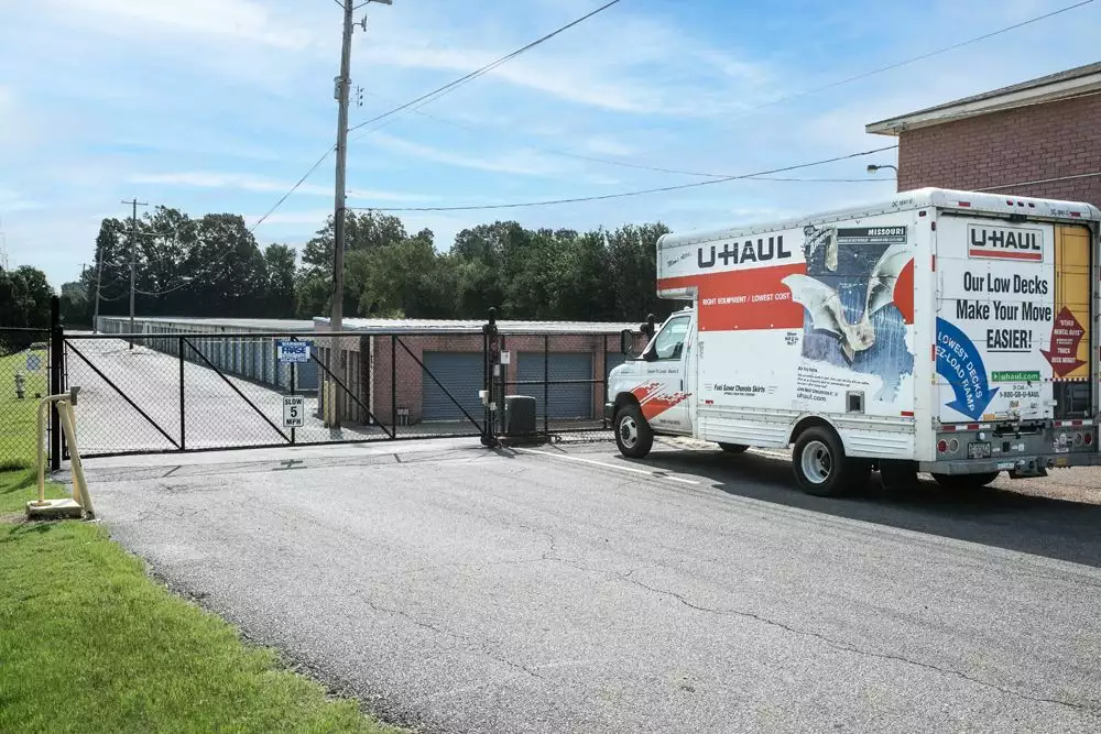 Front security gate and a U-Haul truck.