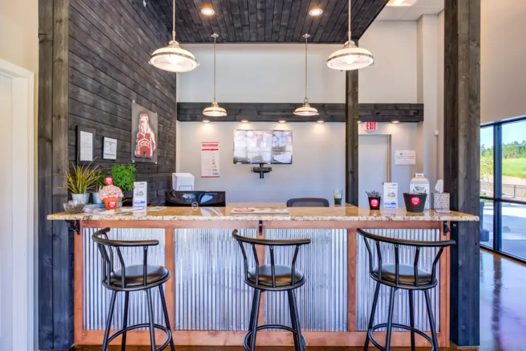 Front desk of a storage facility with barstools