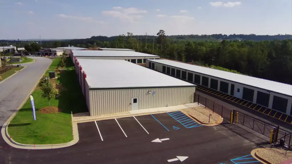 Bird's eye view of green self storage units.
