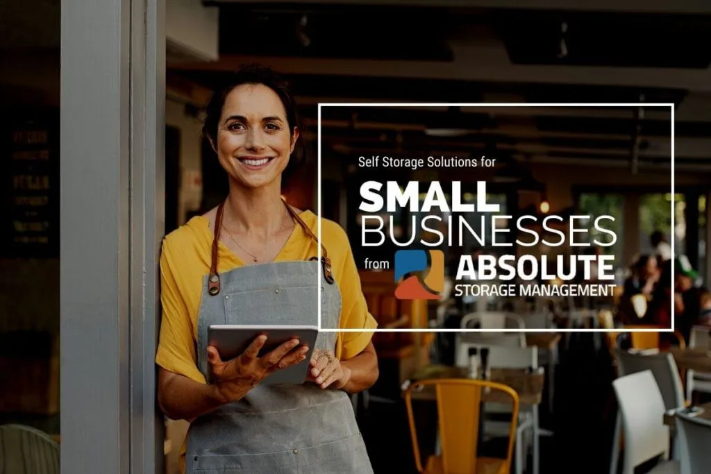 A small business owner standing at the entrance of her storefront.