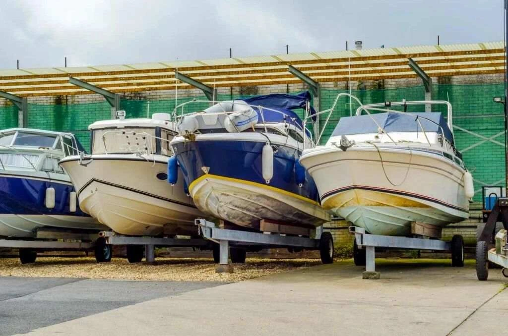 A row of boats under covered storage.