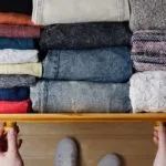 Clothes neatly folded in a drawer.
