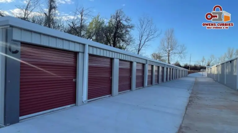 Self storage outdoor units in rows with red doors.