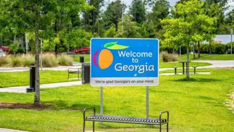 A road sign welcoming people into the state of Georgia.