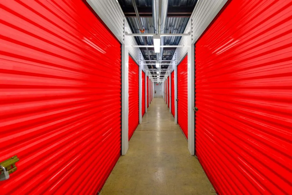 A row of indoor self storage units colored red.